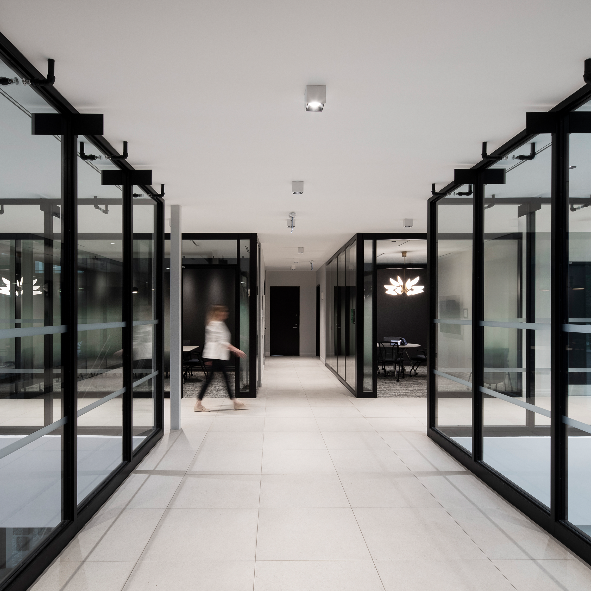 Long hallways with glass offices.