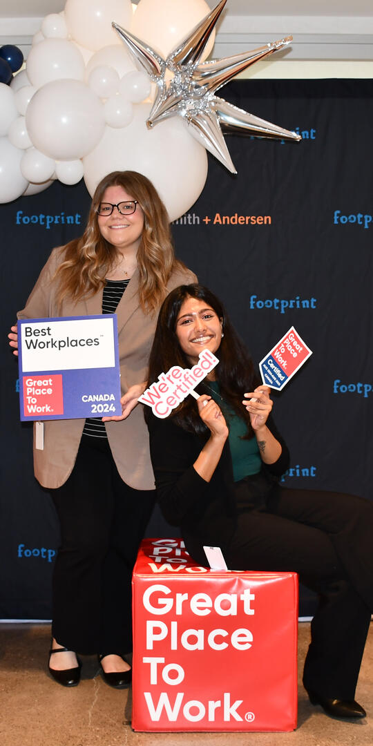 S+A staff holding celebration signs