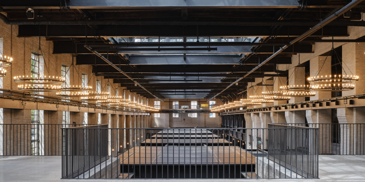 Image of the lighting and exposed beam ceiling from the upper floor.