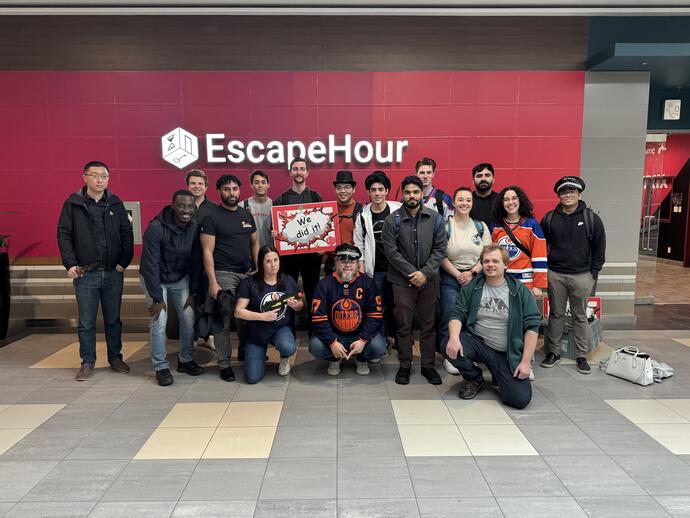 Group Picture of the Edmonton office at the escape room