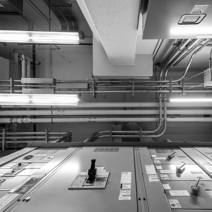 A black and white image of an electrical control panel. 