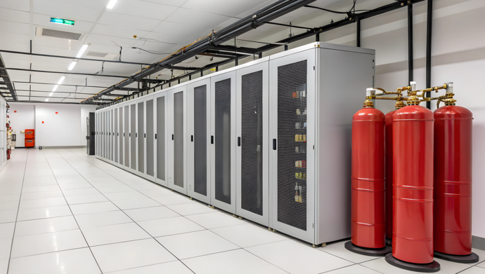 Image of mechanical room with industrial fire extinguishers.